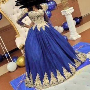 Gold and navy blue, off the shoulder, princess ball gown with a laced up back